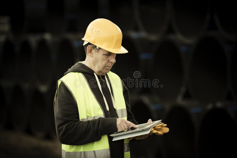 Construction worker using digital tablet stock photography Construction worker using digital tablet stock photography
