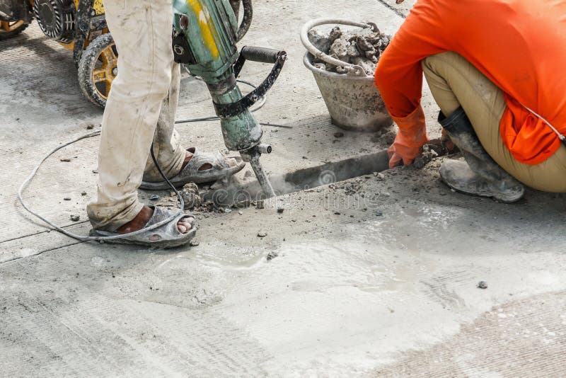 Worker Using Jackhammer Drilling Concrete Surface Stock Photo - Image ...