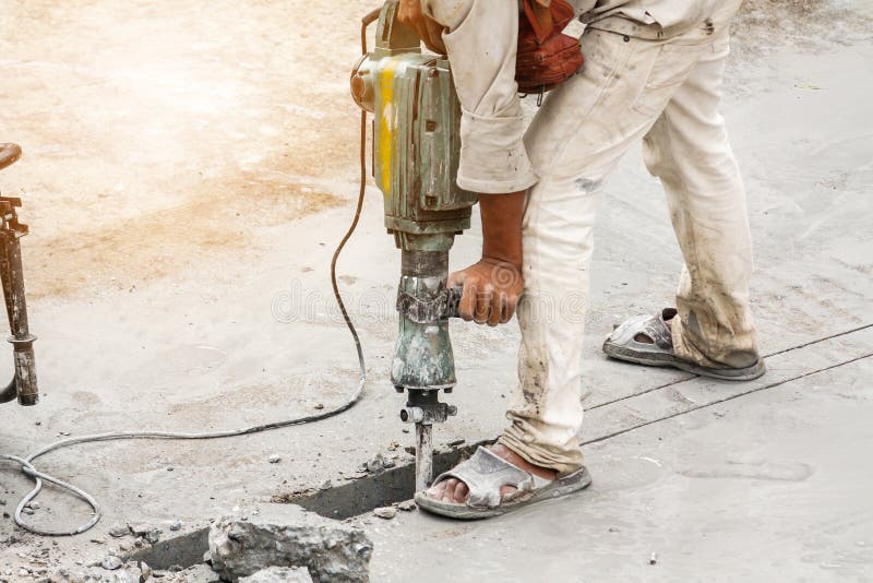 Worker Using Jackhammer Drilling Concrete Surface Stock Image - Image ...