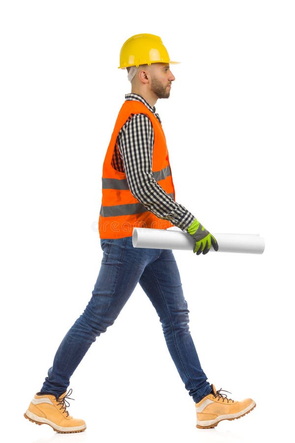 Construction Worker is Walking with Document Roll in Hand. Side View