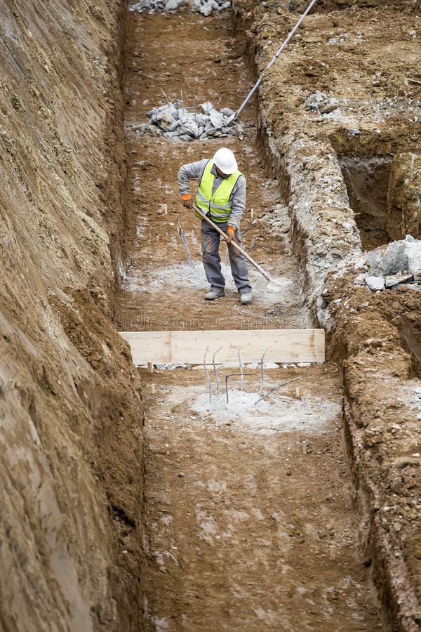 Construction Worker Working on Building Foundation Editorial Image