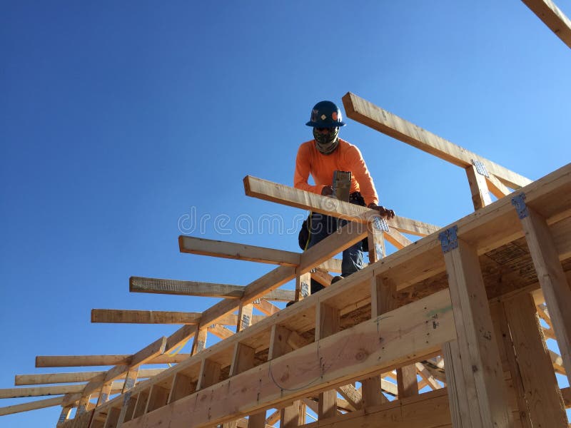 Construction worker working on the framing process for a new a house royalty free stock photos