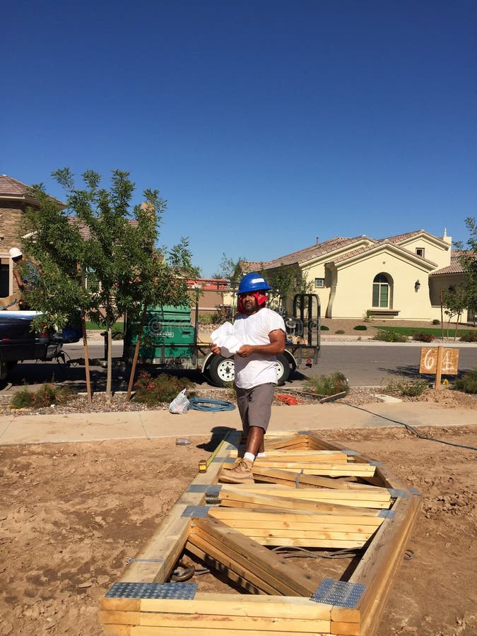 Construction worker working on the framing process for a new a house stock photo