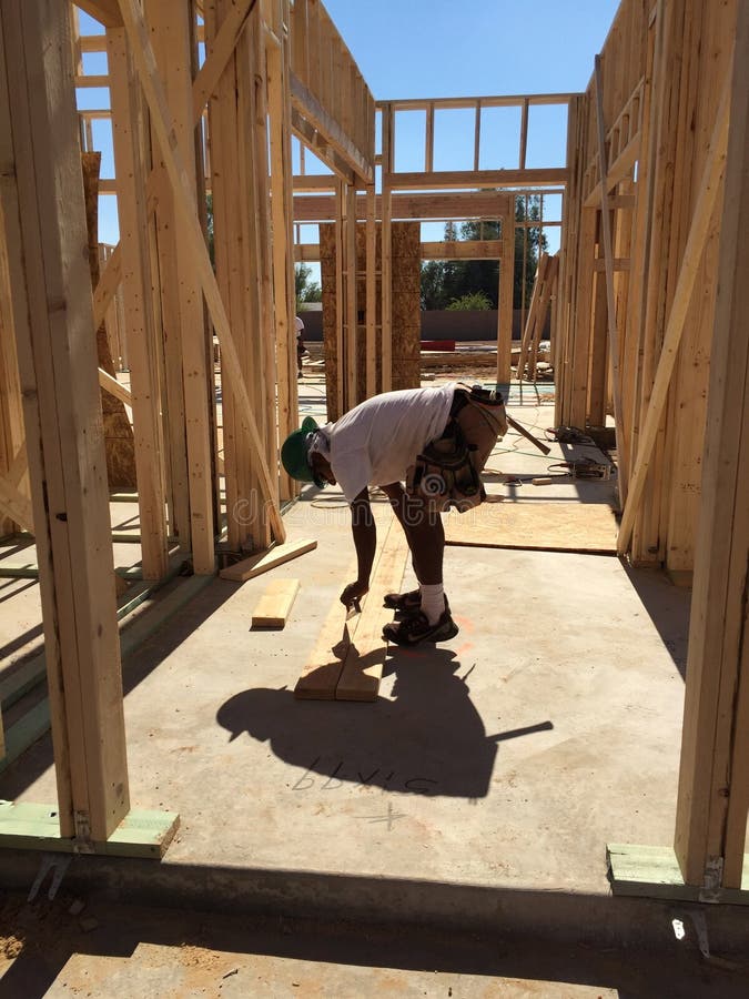 Construction worker working on the framing process for a new a house stock photos