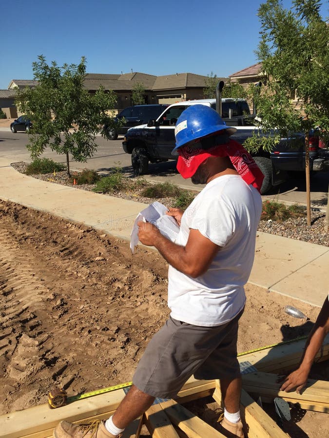 Construction worker working on the framing process for a new a house. royalty free stock photos