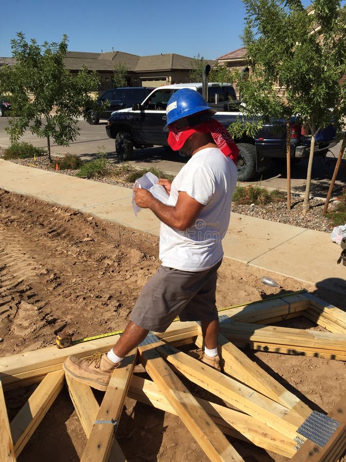 Construction worker working on the framing process for a new a house. royalty free stock photos
