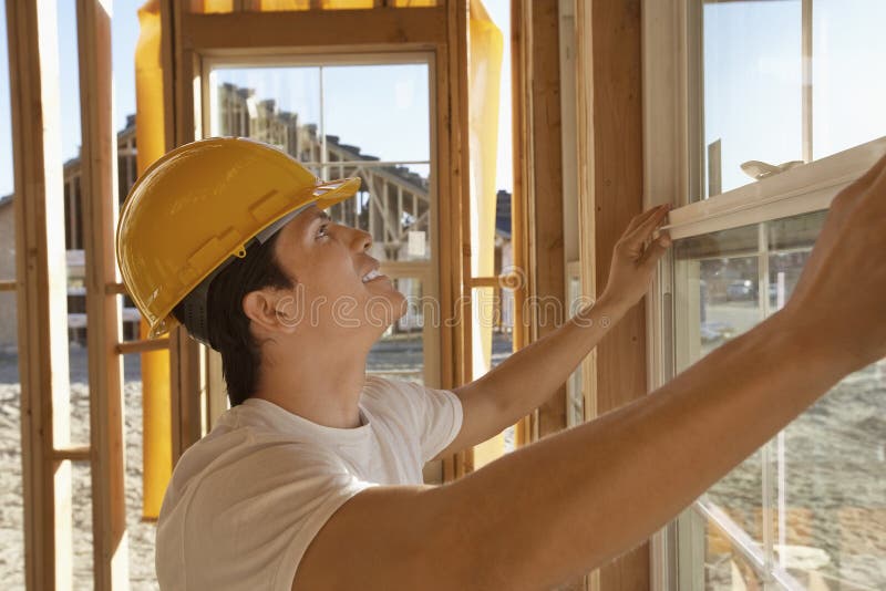 Construction Worker Working On Window