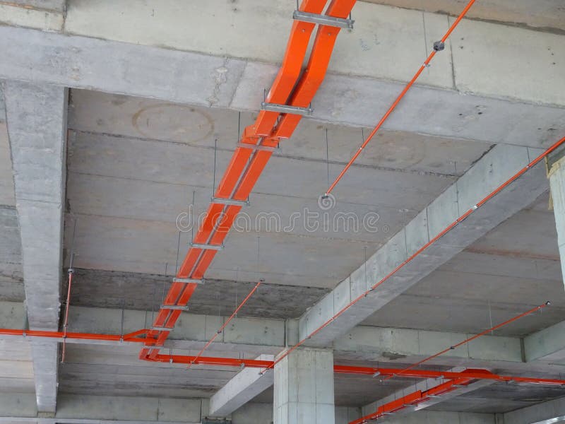 Construction Workers Installing Electrical Conduit and Cable Tray Made