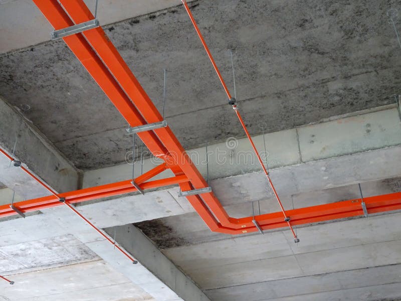 Construction Workers Installing Electrical Conduit and Cable Tray Made