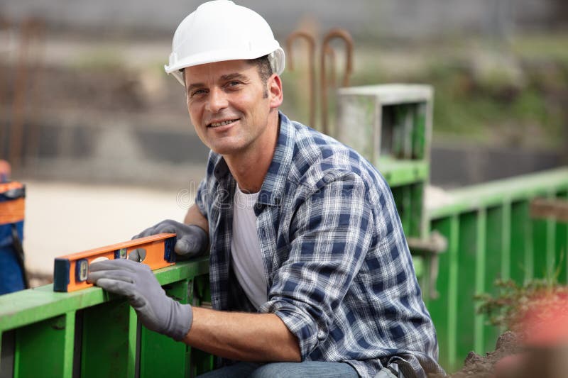 Construction Workers Leveling Wall Stock Photo Image of repair