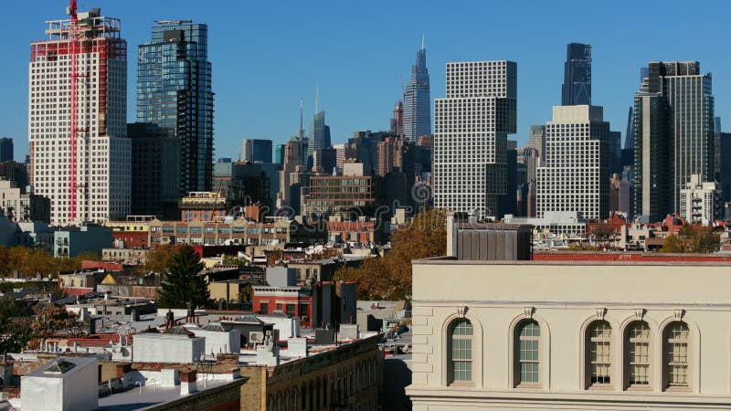 Construction Workers Restore a Rooftop on a Brooklyn Building ...