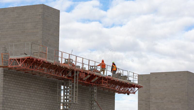 Construction Workers Working On Masonry