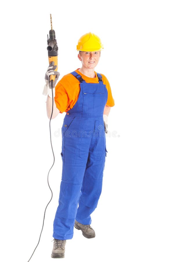 Construtor fêmea com máquina aborrecida fotografia de stock royalty free