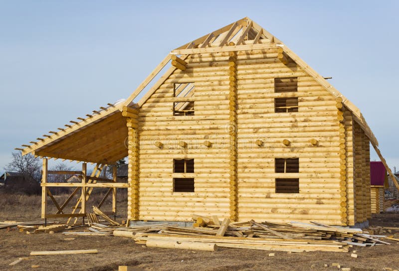 Construction of log houses built on the wasteland. Construction of log houses built on the wasteland