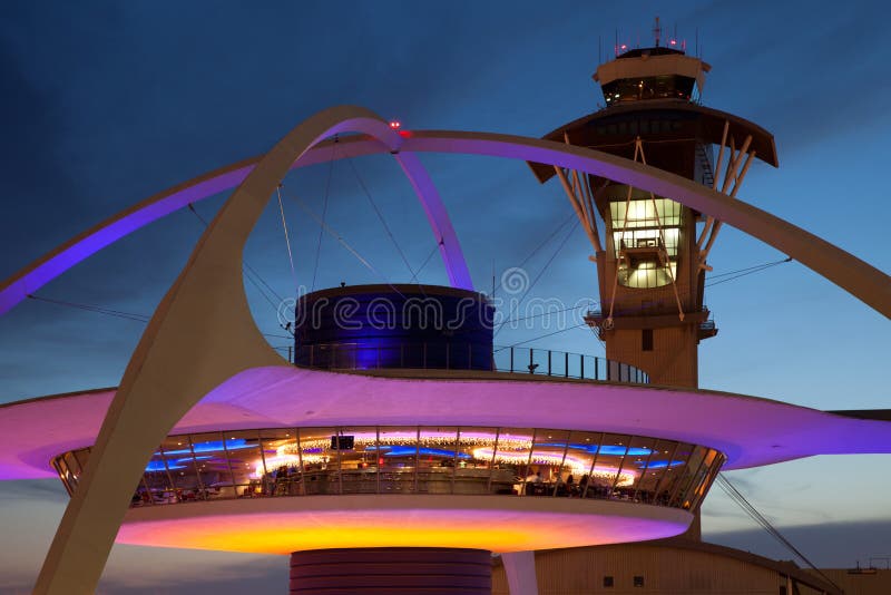 Theme Building and tower of Los Angeles International Airport at dusk. Theme Building and tower of Los Angeles International Airport at dusk