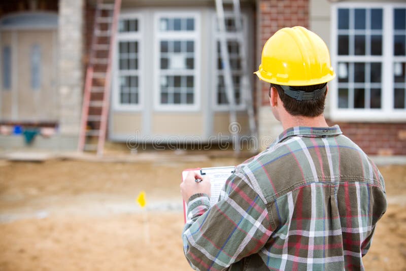 Construção: Inspetor home que faz a revisão fotos de stock Construção: Inspetor home que faz a revisão fotos de stock