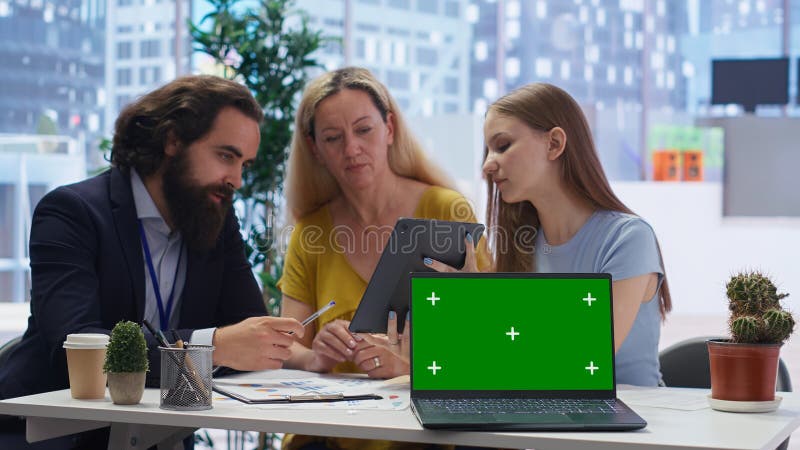 Consultant uses financial planning software on chroma key notebook stock photos