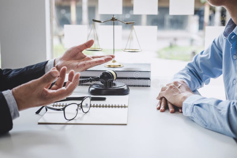 Consultation and conference of Male lawyers and professional businesswoman working and discussion having at law firm in office. royalty free stock photo Consultation and conference of Male lawyers and professional businesswoman working and discussion having at law firm in office. royalty free stock photo
