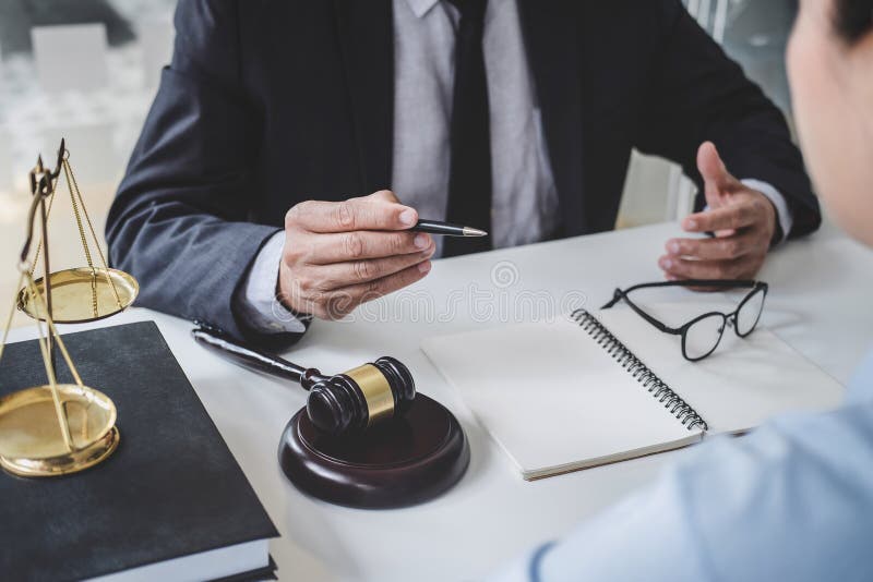 Consultation and conference of Male lawyers and professional businesswoman working and discussion having at law firm in office. stock photos Consultation and conference of Male lawyers and professional businesswoman working and discussion having at law firm in office. stock photos