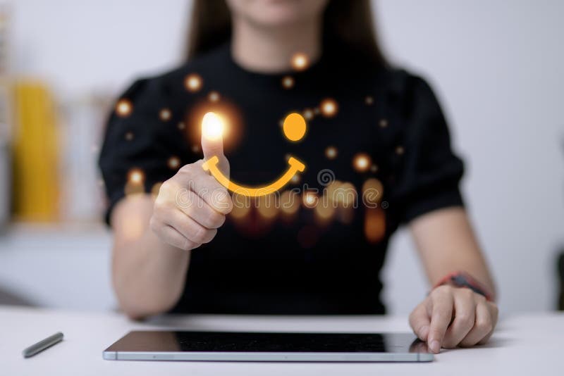 The consumer answered the survey in a conceptual way. Customer creates a happy face smiling symbol using a digital pen. The notion royalty free stock image
