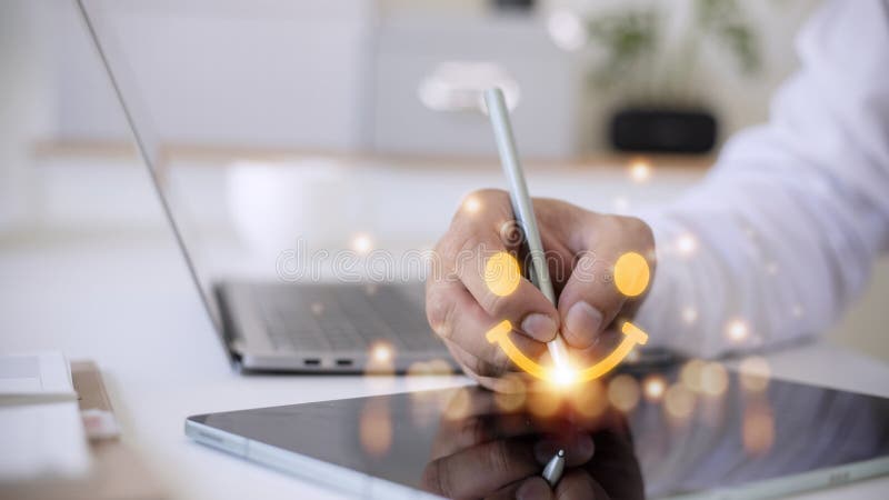 The consumer answered the survey in a conceptual way. Customer creates a happy face smiling symbol using a digital pen. The notion stock photography