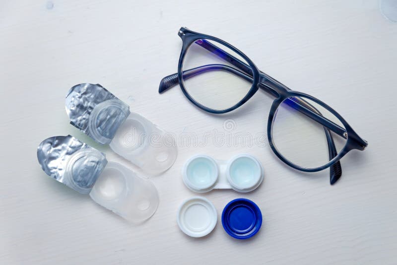 Contact Lenses and Glasses on a White Surface. Stock Image Image of