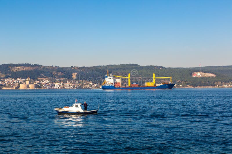 CANAKKALE, TURKEY - JULY 21, 2017:  Big container ship in Dardanelles strait, Turkey in a beautiful summer day