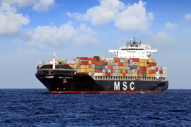 Big container ship of MSC Company sailing in open waters.