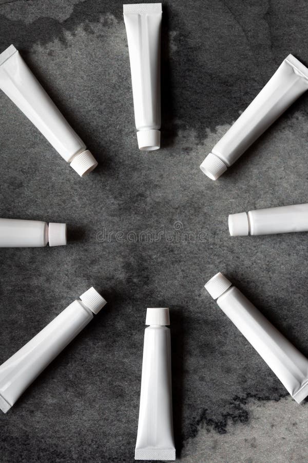 White Plastic Tubes with Dark Background Stock Image Image of