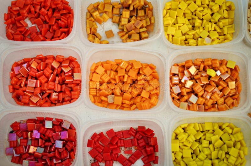 Containers with colored glass elements for mosaic. Yellow, red, orange. Creativity. art . royalty free stock photos Containers with colored glass elements for mosaic. Yellow, red, orange. Creativity. art . royalty free stock photos