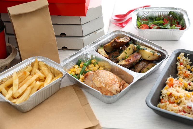 Containers with Tasty Takeout Meals on Table. Food Delivery Stock Photo