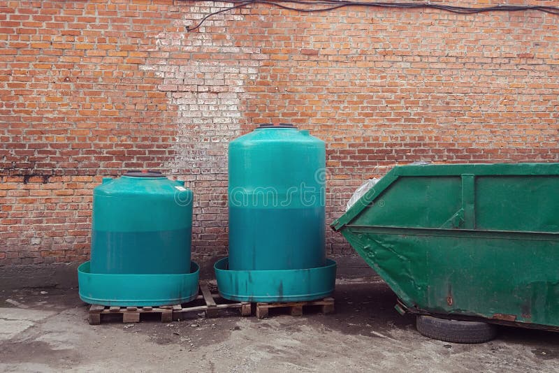 Containers with Waste Engine Oil for Disposal and Trash Bin Stock Image