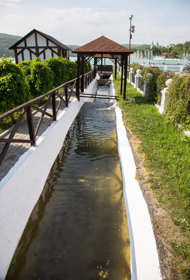 Contaminated water, sewage waste is drained through pipe into sea on an unequipped beach. Pollution of environment, ecological cat stock images