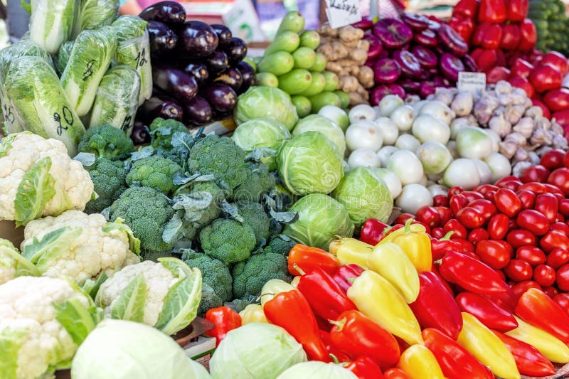 Vegetable farmer market counter. Colorful heap of various fresh organic healthy vegetables at grocery store. Healthy natural food. Vegetable farmer market counter. Colorful heap of various fresh organic healthy vegetables at grocery store. Healthy natural food