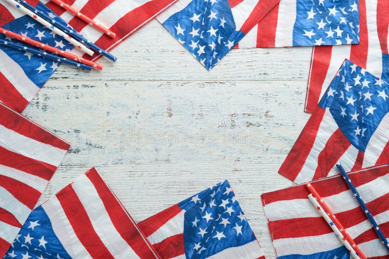 4th of July background. US flag paper napkin and picnic cocktail straws on old white table background. Happy Labor, Independence, Presidents Day. Happy picnic concept. American flag colors. Mock up. 4th of July background. US flag paper napkin and picnic cocktail straws on old white table background. Happy Labor, Independence, Presidents Day. Happy picnic concept. American flag colors. Mock up