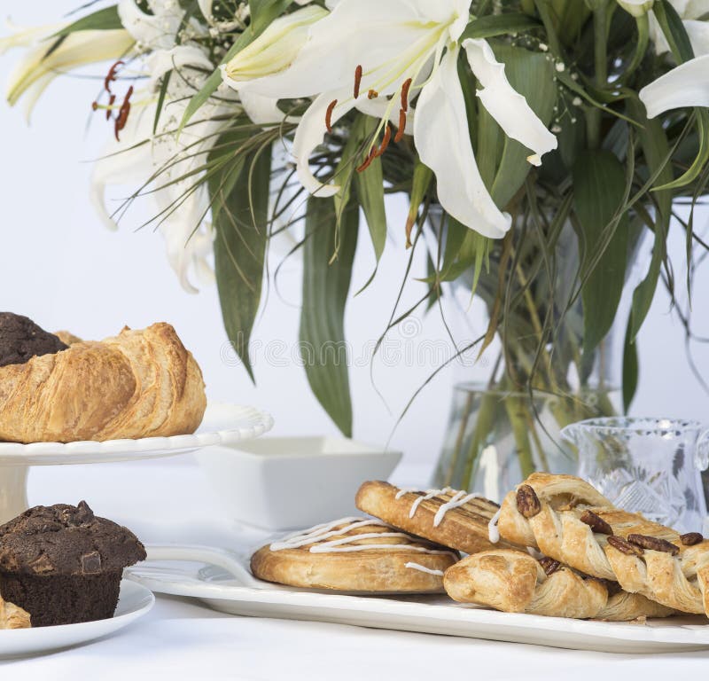 Continental Breakfast Table Setting with Pastries and Cakes Stock Image