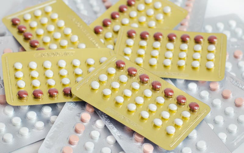 Contraceptive Pills on a Calendar. Stock Photo Image of background