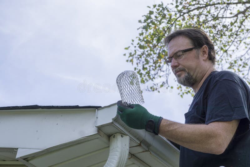 Contractor Examing Down Spout Filter before Installation Stock Photo Image of gutter, leaf