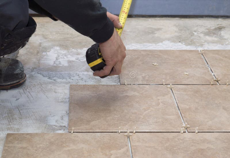 Tiling A Basement Floor With Ceramic Tiles Stock Image Image Of
