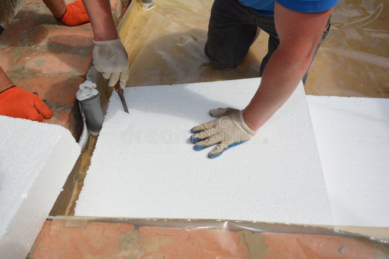 Contractor Installing Foam Insulation on the Floor. Bathroom Floor Layers Construction with