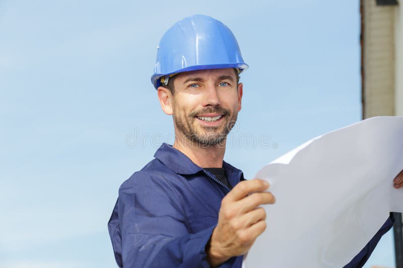 Contractor Man with Helmet Holding Blueprints Stock Image Image of