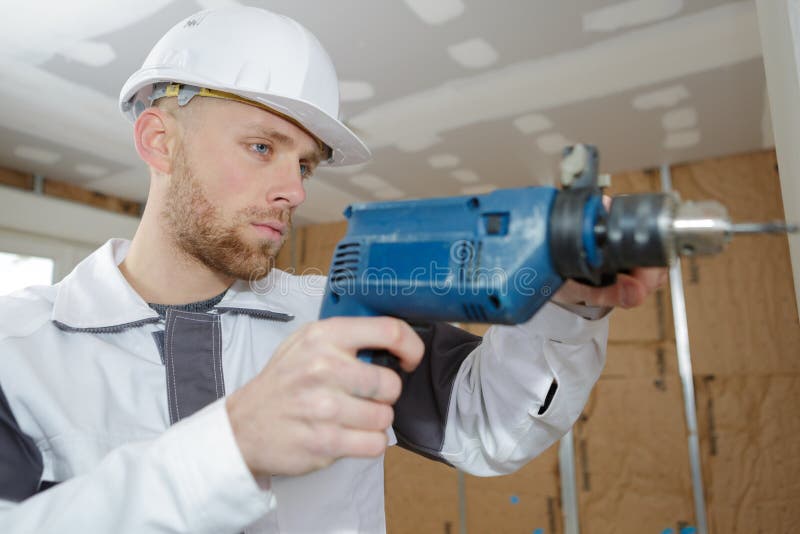 Contractor Uses Hammer Drill To Drill Concrete Wall Stock Image Image of hand, black 95480355