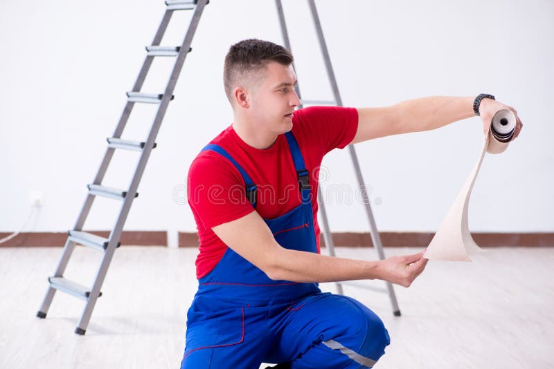The contractor worker preparing for wallpaper decoration royalty free stock image