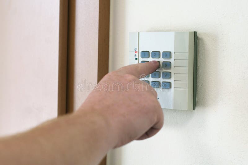 Man introduces an access control code. Man introduces an access control code