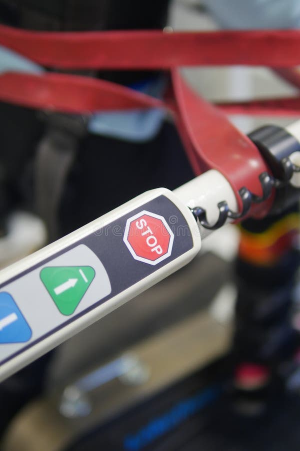 Control panel of a mobility device showing stop button and icons royalty free stock photography