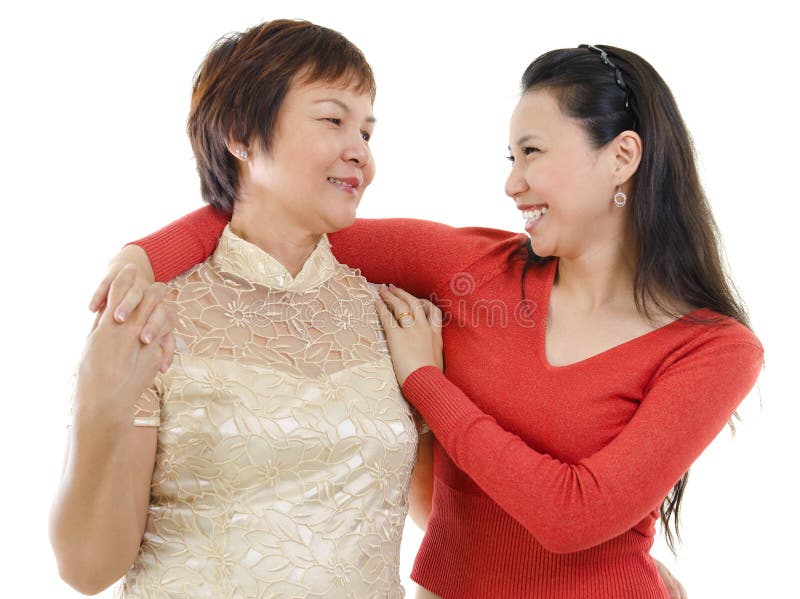 Mixed race Asian mother and daughter having conversation on white background. Mixed race Asian mother and daughter having conversation on white background