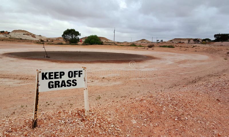 The iconic Golf Course at Coober Pedy, featuring black 'greens' and dusty, desert fairways. The iconic Golf Course at Coober Pedy, featuring black 'greens' and dusty, desert fairways.