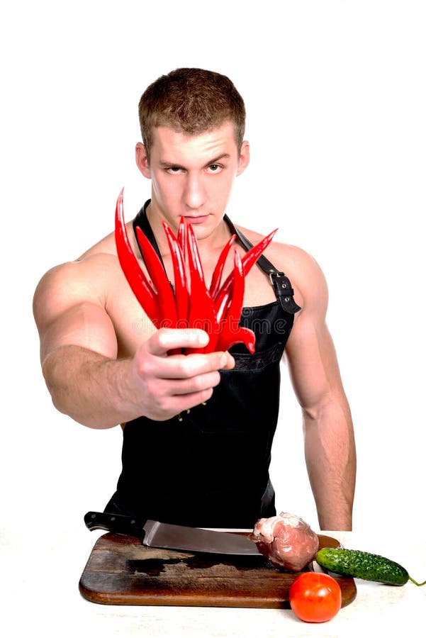Athletic young man in an apron on a white background. royalty free stock photography Athletic young man in an apron on a white background. royalty free stock photography