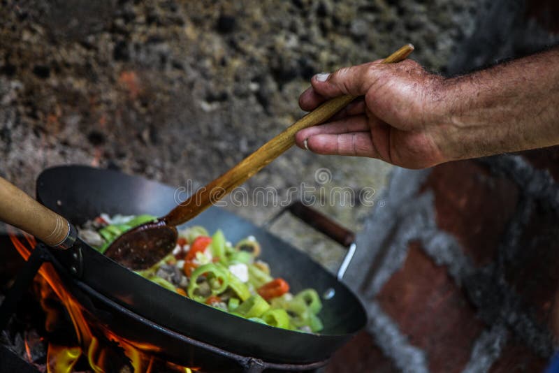 The cook prepares food in nature royalty free stock photo