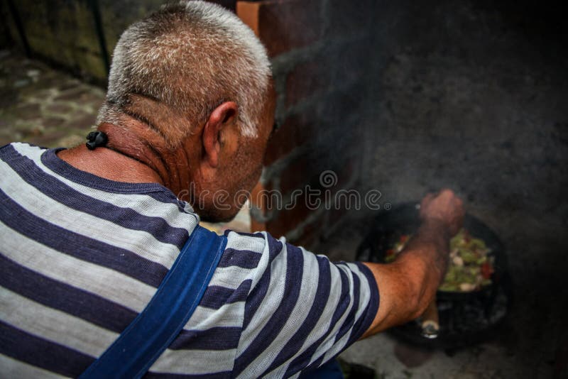 The cook prepares food in nature royalty free stock images